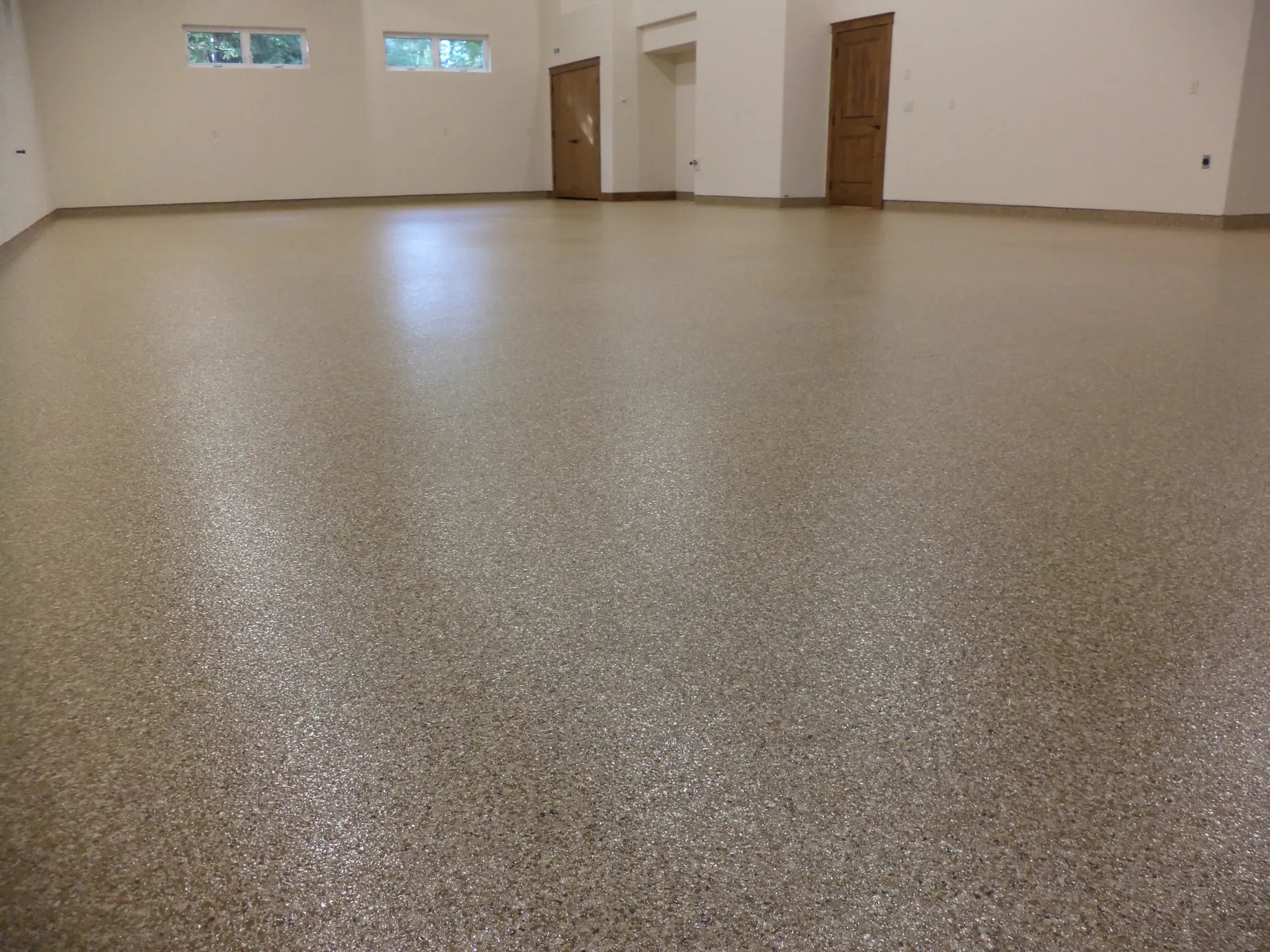 Shop floor finished in a warm Hickory-toned flake coating.