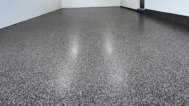 Garage with a dark, high-gloss flake floor coating.