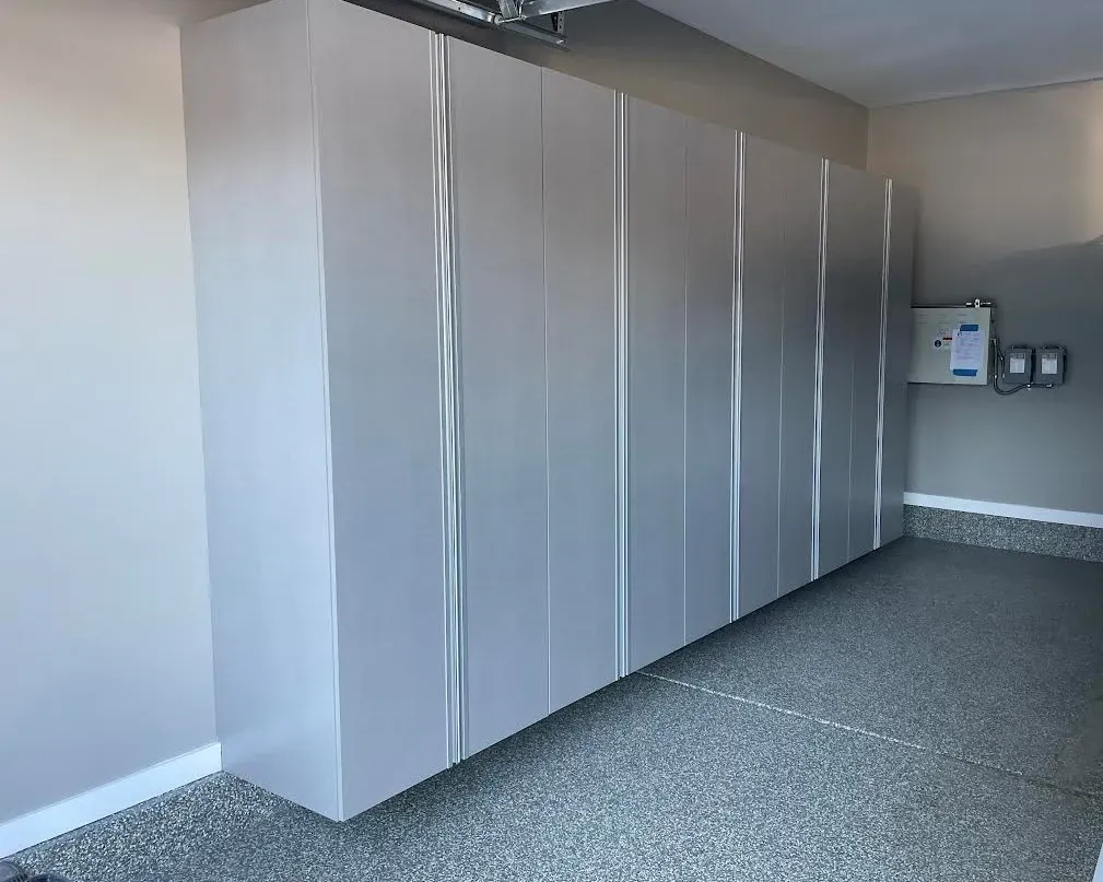 Tall pantry-style garage cabinets in a finished garage.