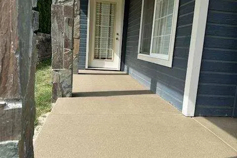 Home walkway finished with a gold Sandcastle sand overlay.